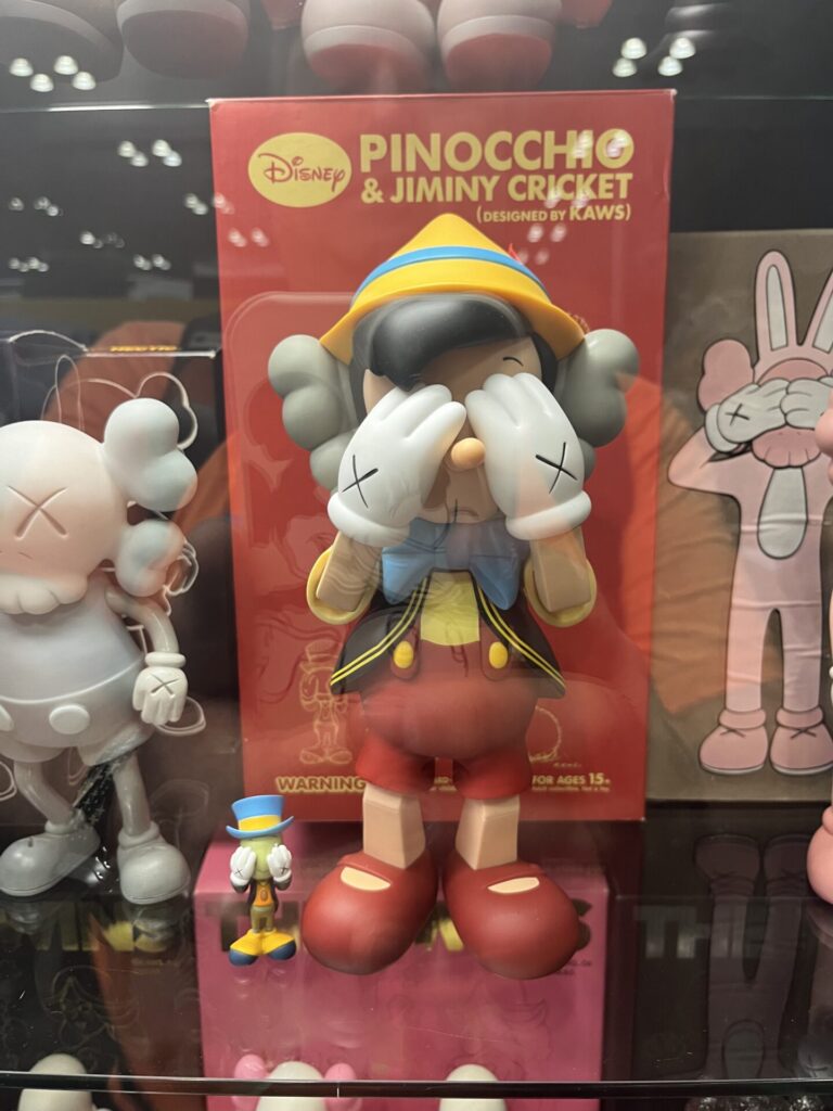 A Kaws statue of Pinocchio and Jiminy Cricket. Photo by Chris Barry.