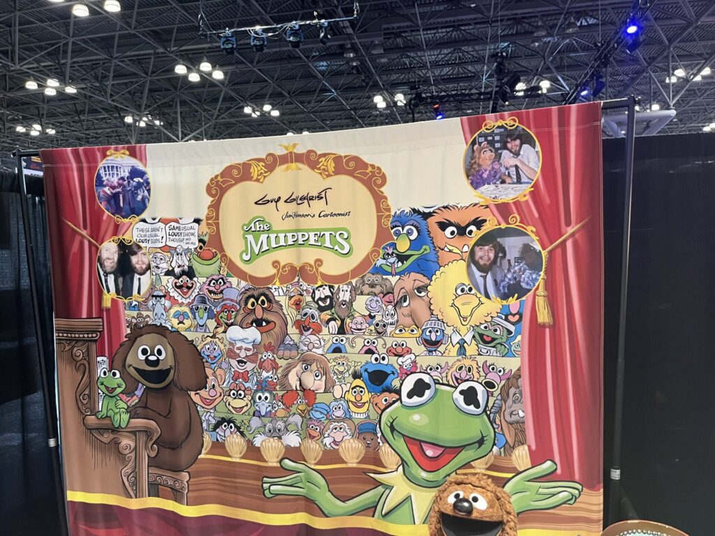 The backdrop for The Muppets Comic artist Guy Gilchrist's booth. Photo by Chris Barry.
